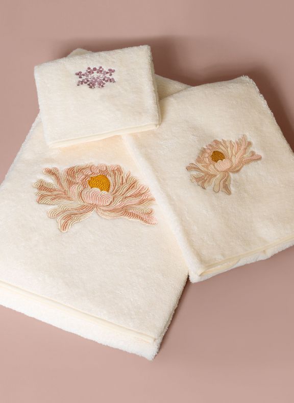 beige luxury bath towels with embroidery