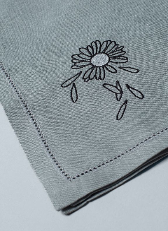 grey luxury table linens with embroidered flower