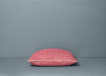 Audrey pink linen pillow on floor
