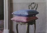 Blue and pink linen pillows on a chair