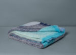 Les Bleus mohair throw, in shades of blues folded