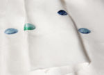 detail of Galets natural white flat sheet pebble embroideries