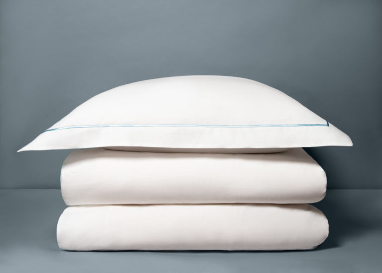 Galets square pillow with folded duvet.