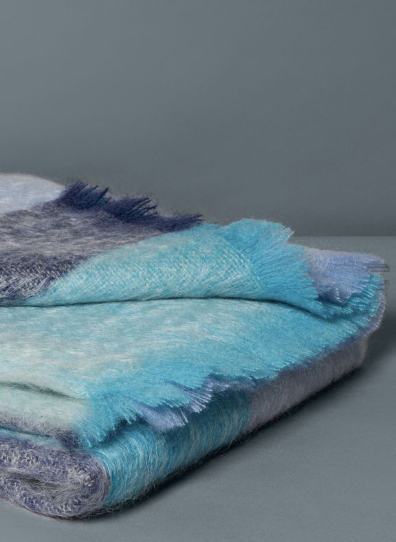 Mohair throws with different blues folded