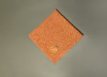 Orange napkin with pumpkin embroidery